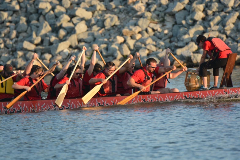 rowers prepare to row in a dragon boat