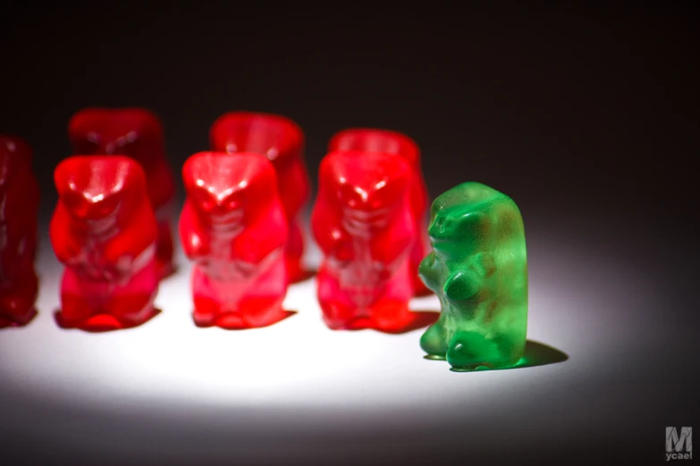 a toy is shown sitting in front of a small group of plastic bears