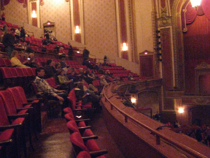 this is an auditorium filled with people, facing toward the stage
