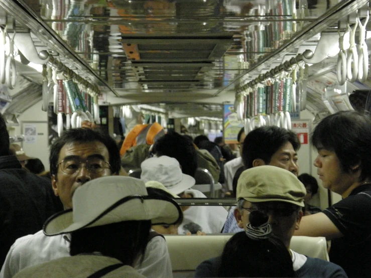 a bus with many passengers on it's seats