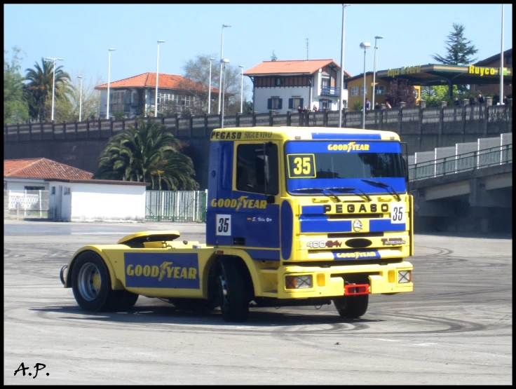 a large semi truck with a flat bed trailer attached to the side