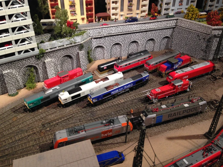a train yard is shown with miniature trains