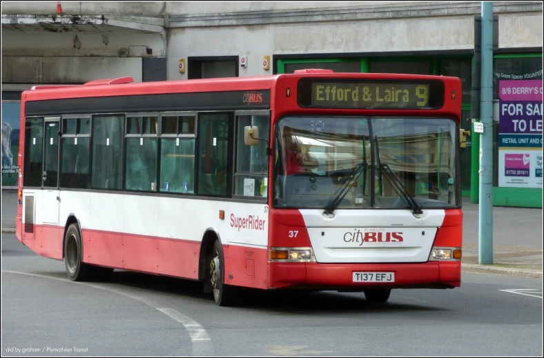 a public transit bus is on a city street