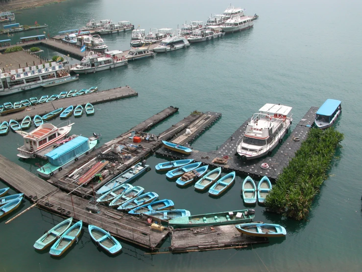 a marina with lots of boats docked at it's piers