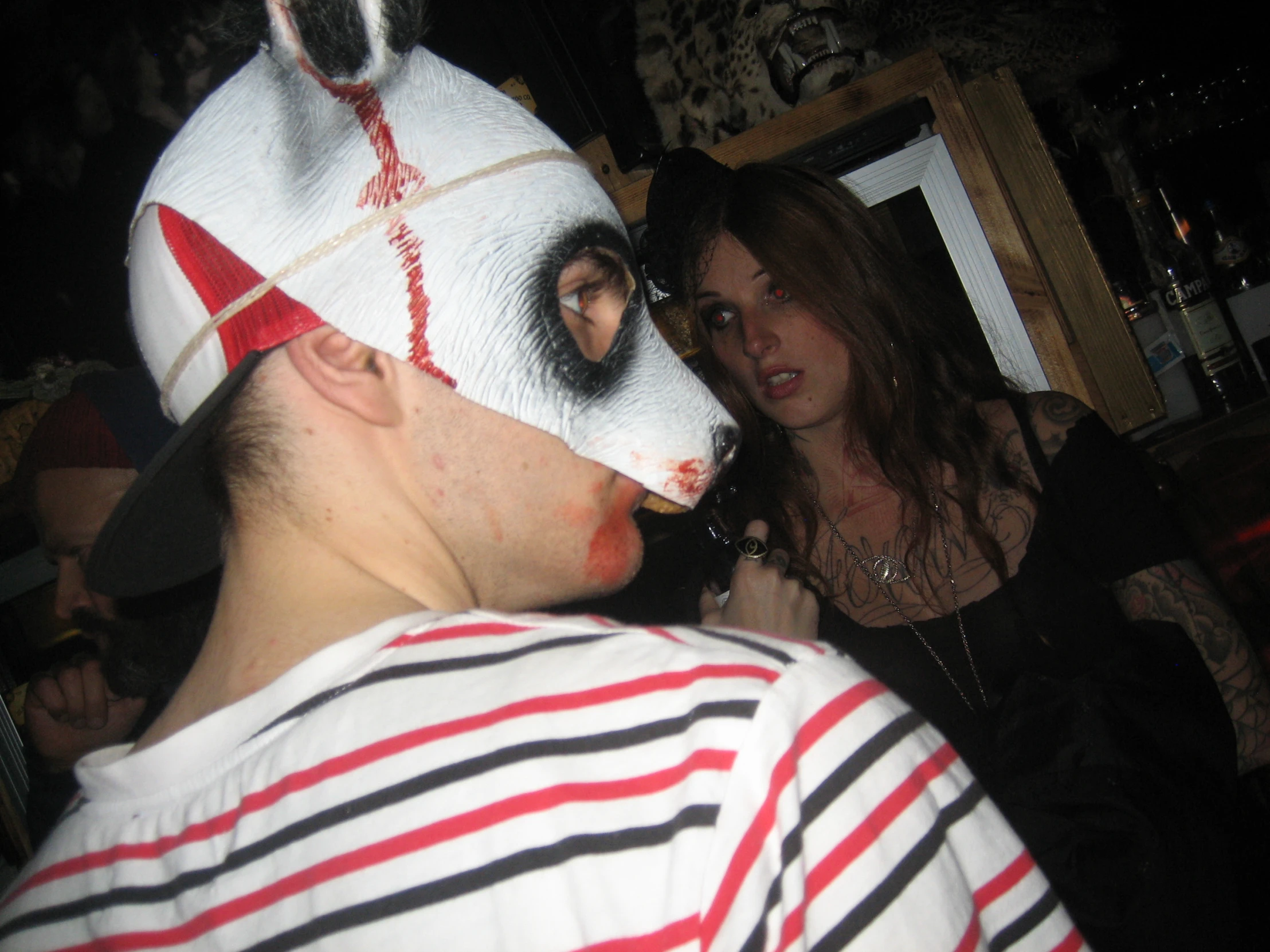 a person in an old fashioned mask has soing on his face