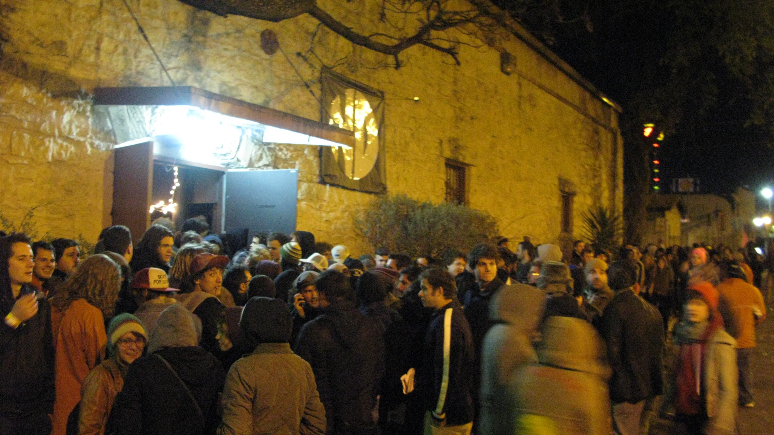 a crowd of people outside in the dark