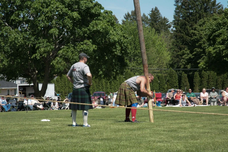 a man in a kilt playing a game with another player