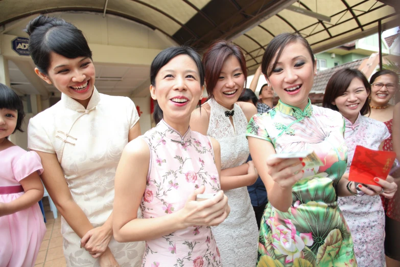 a group of young women standing next to each other