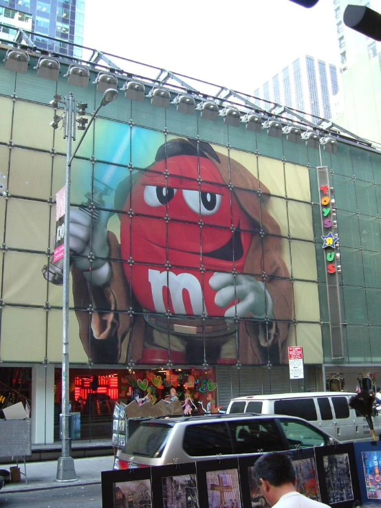 a giant billboard on the side of a building in the city