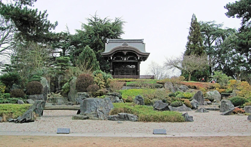 a very old structure surrounded by trees and rocks