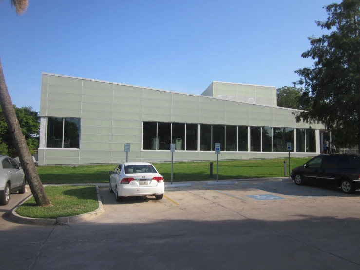 several cars parked in front of a building