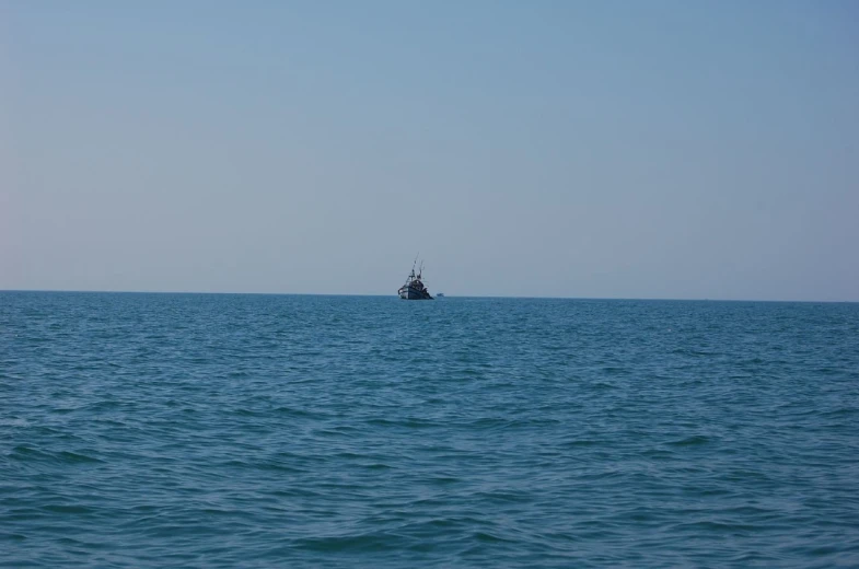 a sailboat sailing in the open sea