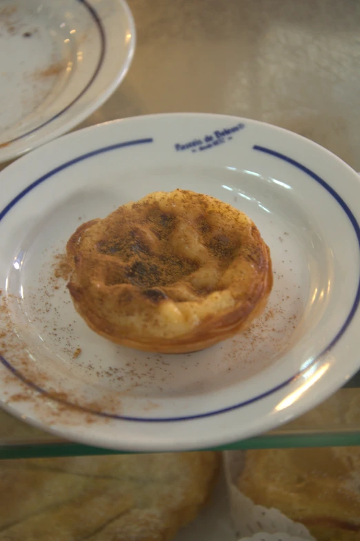 a small pastry sitting on a white plate