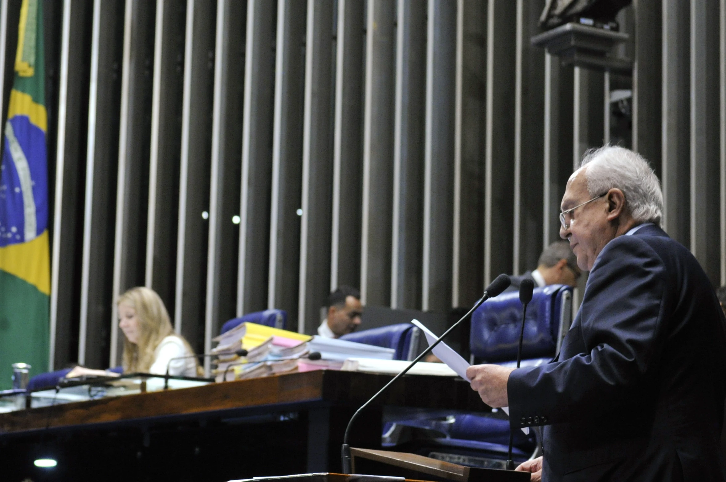 a man standing at a podium giving a speech