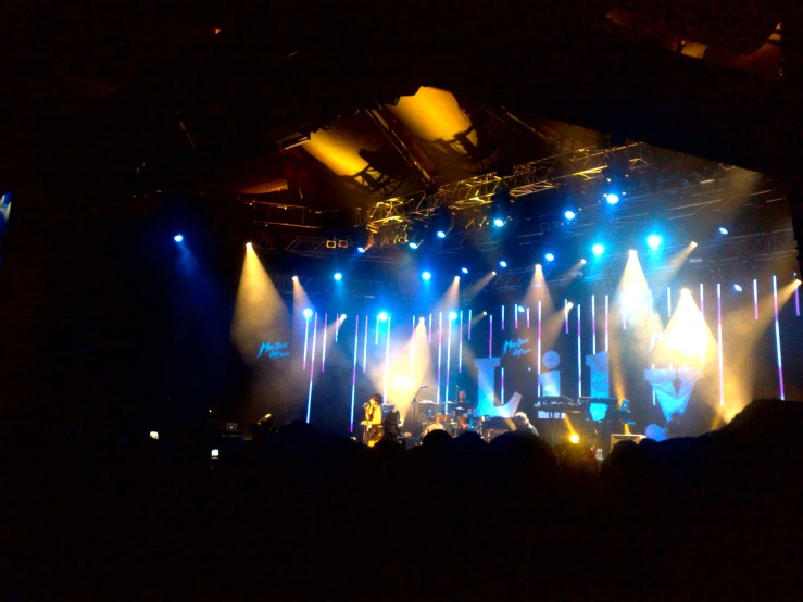 stage lighting is shining brightly blue and purple