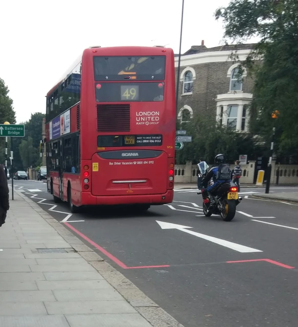 a double decker bus traveling down the street