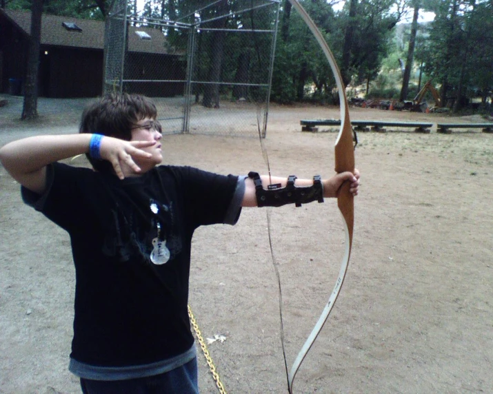 a person holds his arms up to a bow