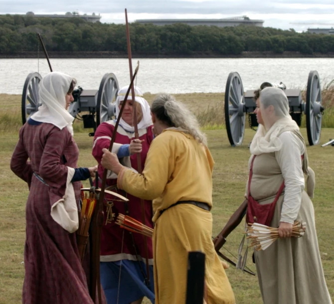 a group of people with arrows in a field