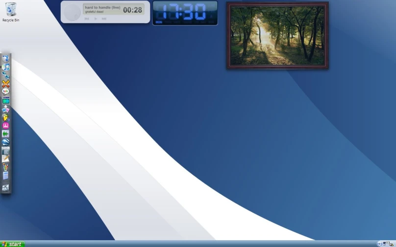 a computer that is displaying images and a clock