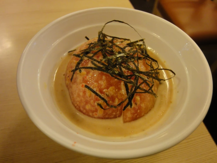 an odd looking dish has been prepared in a small bowl