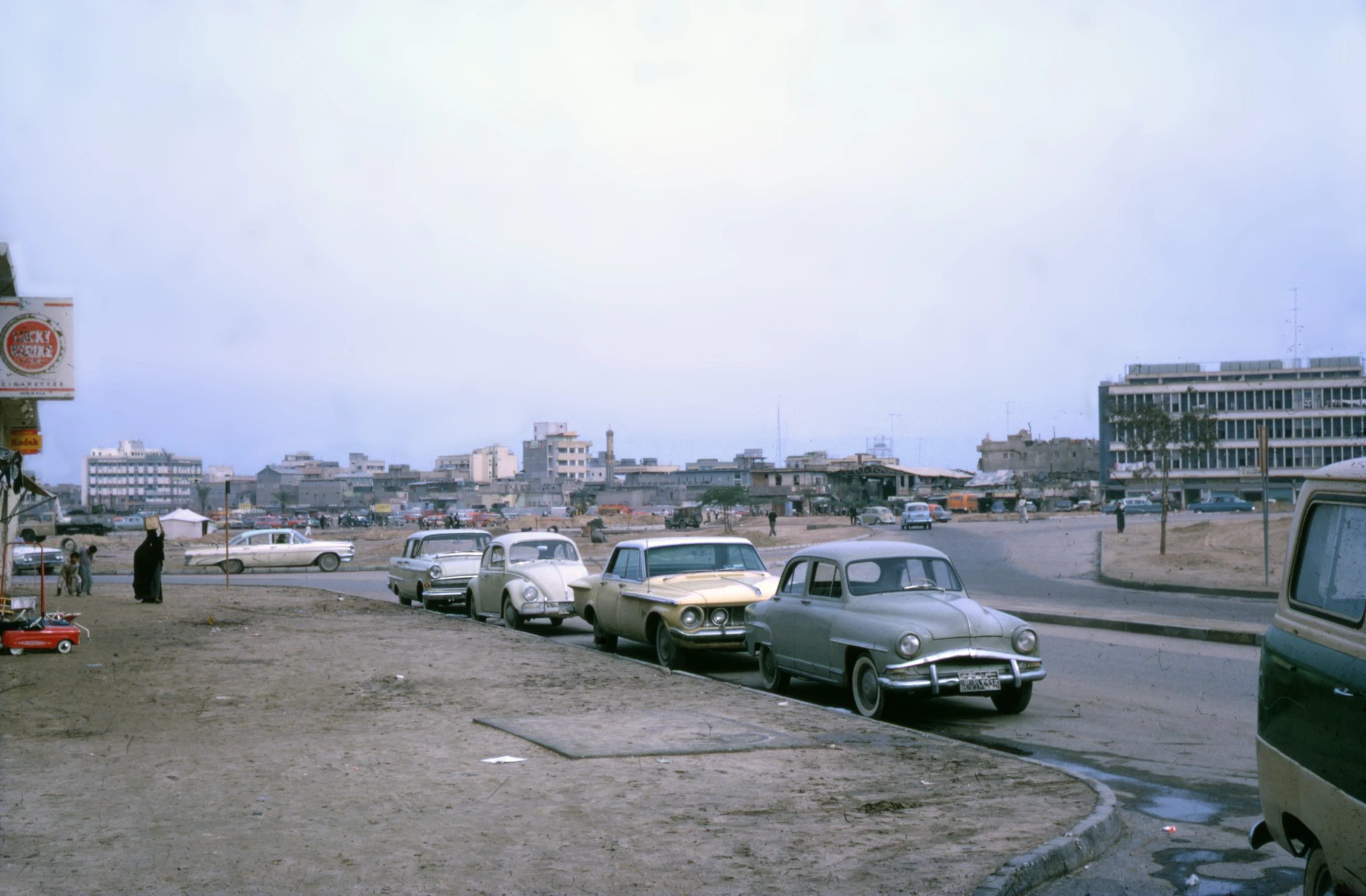 the cars are parked on the side of the road