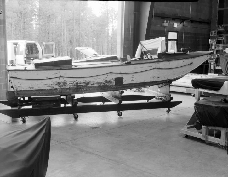 a boat that is on a dolly in the process of being finished