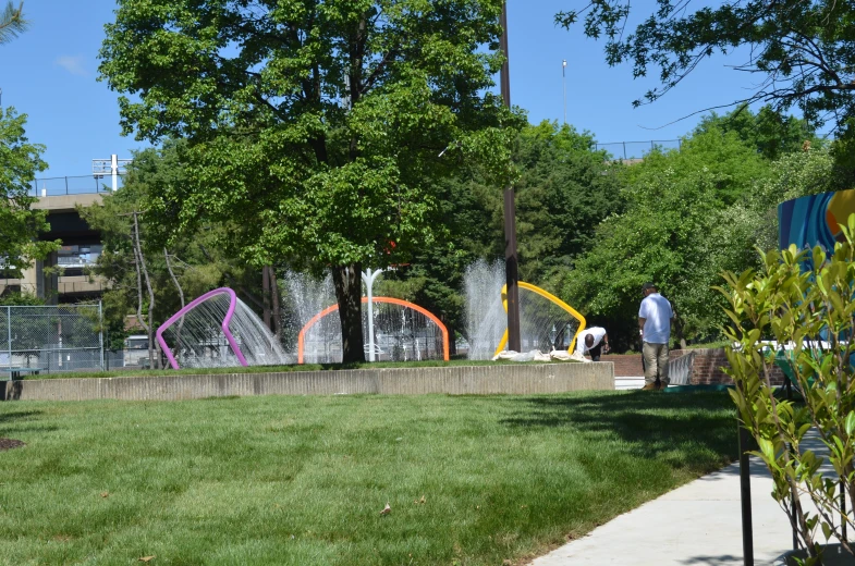 the grass has been trimmed off with colorful sculptures