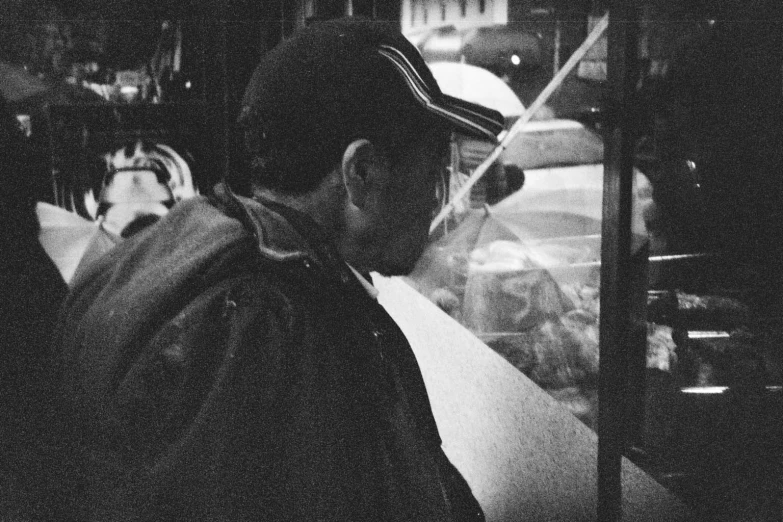 a man riding the bus and looking out the window