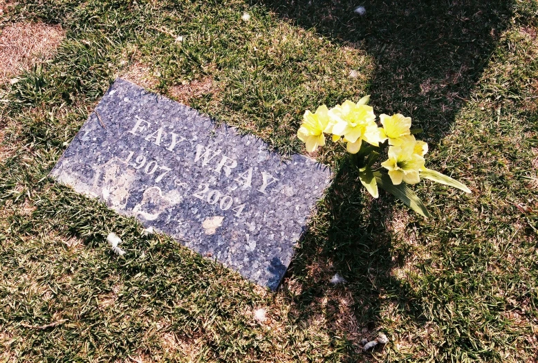 a memorial is sitting on a green lawn