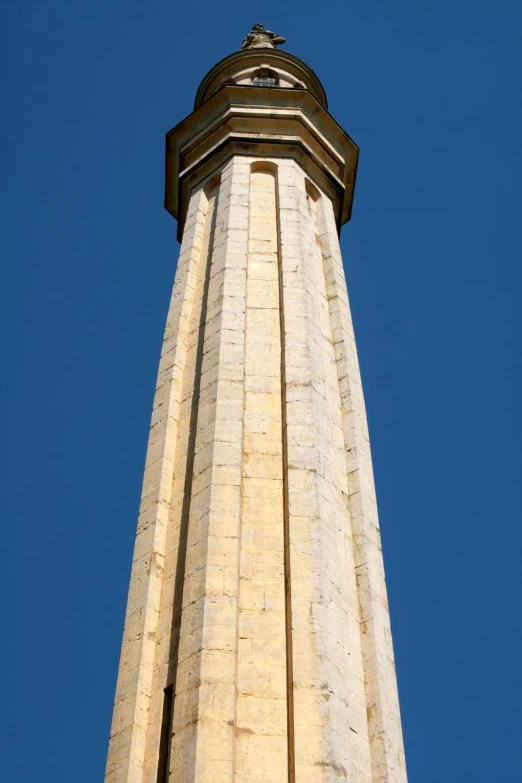 the top of an old column on a clear day