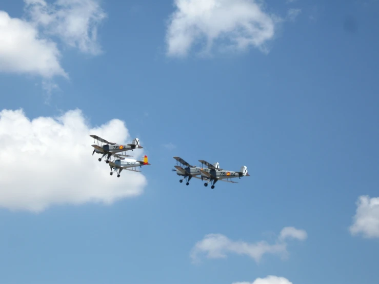 two planes flying in formation into the sky