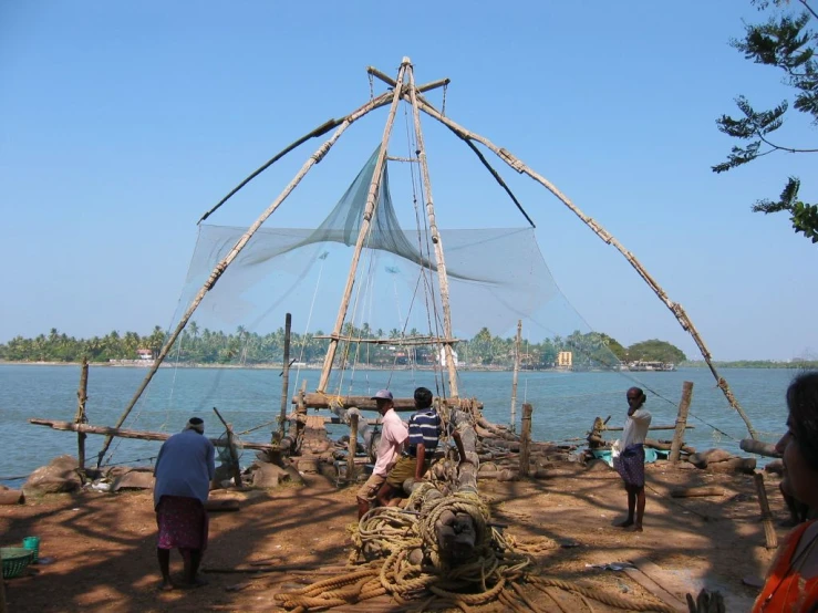 many people gather near the ocean to fishing