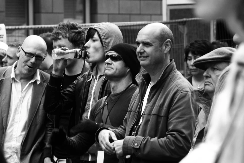 people looking through binoculars in the street