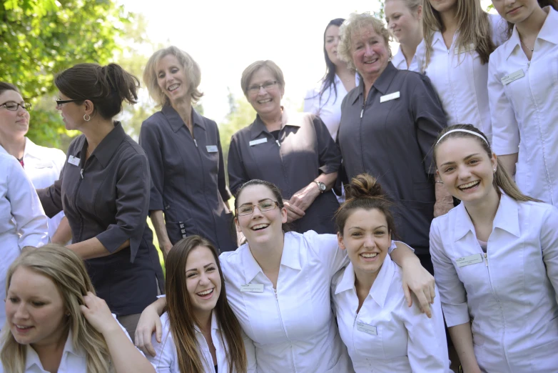 a group of women in uniforms posing for the camera