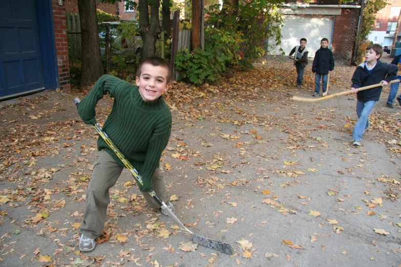 some s on the street playing baseball