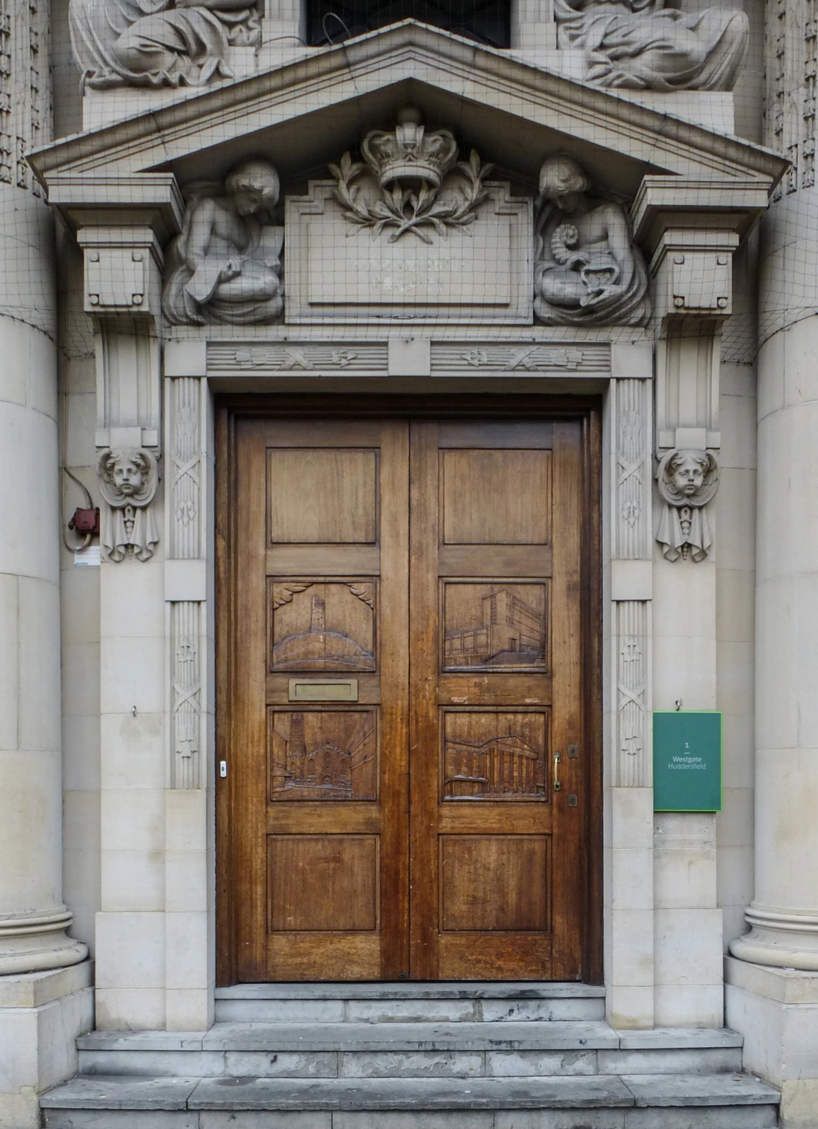 an old church has a wooden door and planters