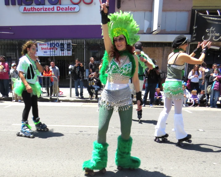 a woman dressed in green, white and black