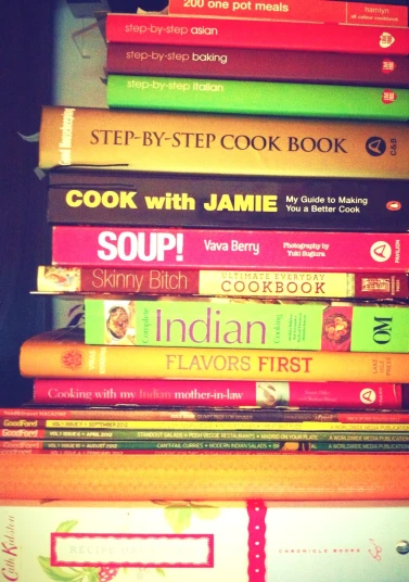 stack of cookbooks in front of the camera