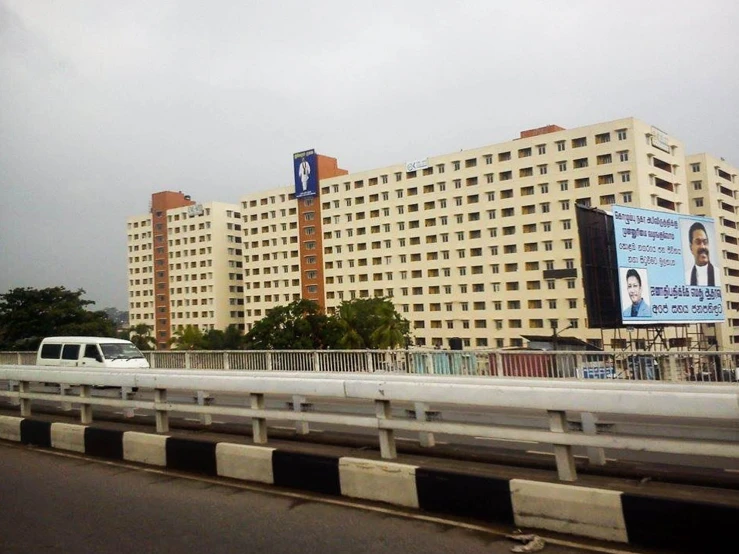 an outdoor view of some buildings and some billboards