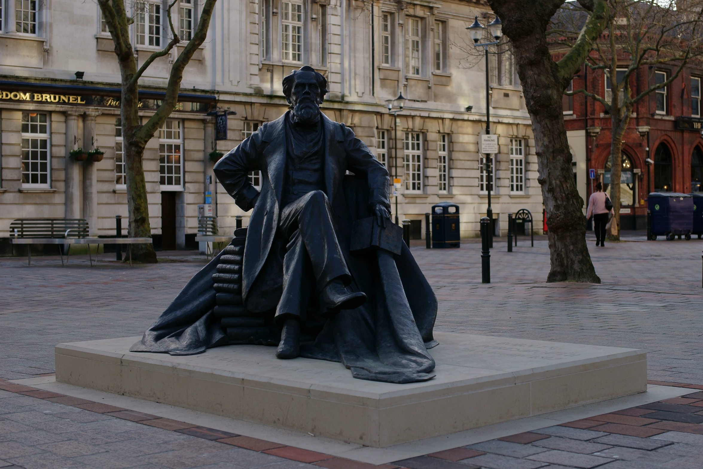 a statue of a man with his foot on a pillow