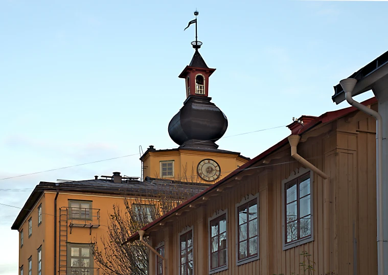 the top of an old building features a clock tower