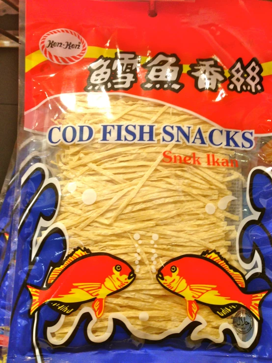 a package of fish snacks in front of a display case