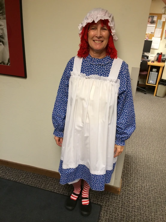 a women who is wearing a blue and white outfit