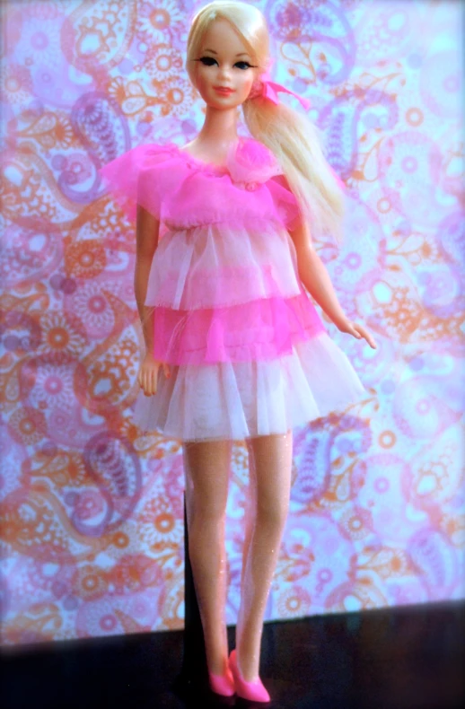 doll in short white dress wearing pink shoes