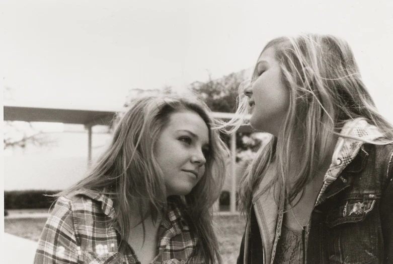 black and white po of two women smoking cigars