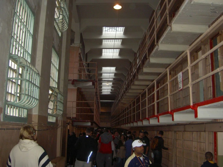 several people are lined up inside of a building