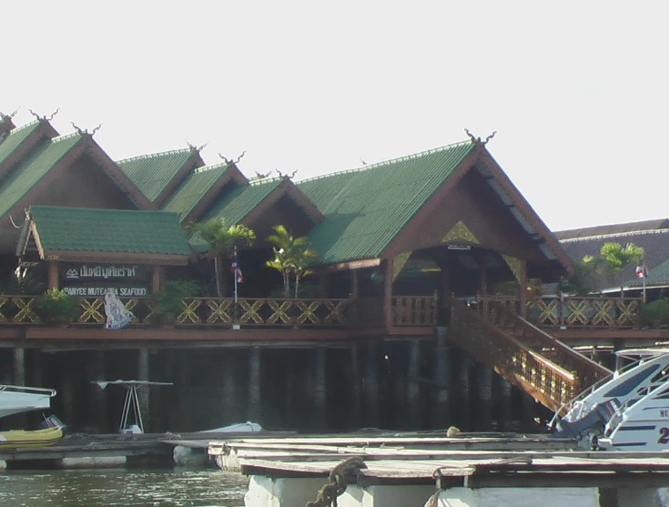 boats parked on the dock beside a marina