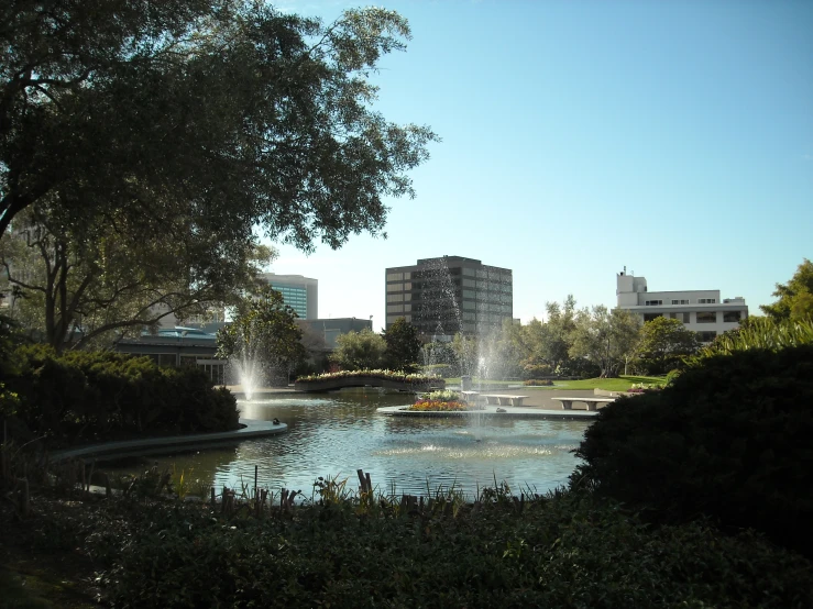 a water feature is surrounded by several buildings