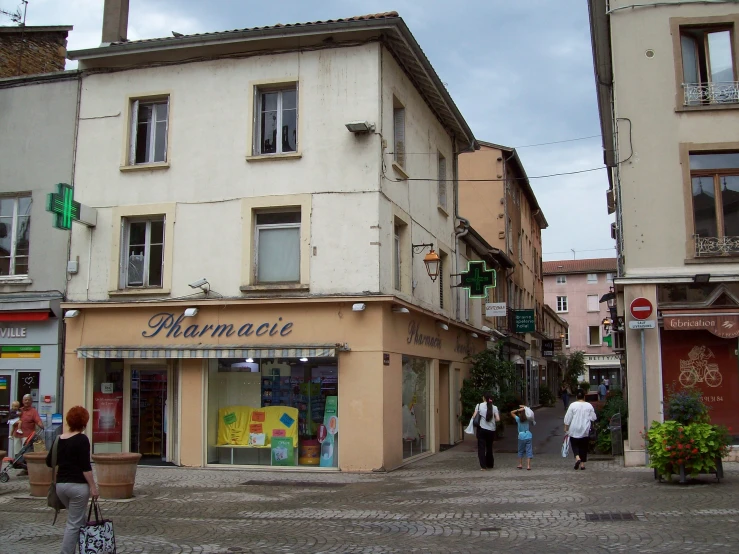 a group of people that are walking around on a street