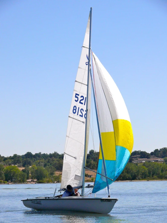 the sailboat is traveling fast on the lake